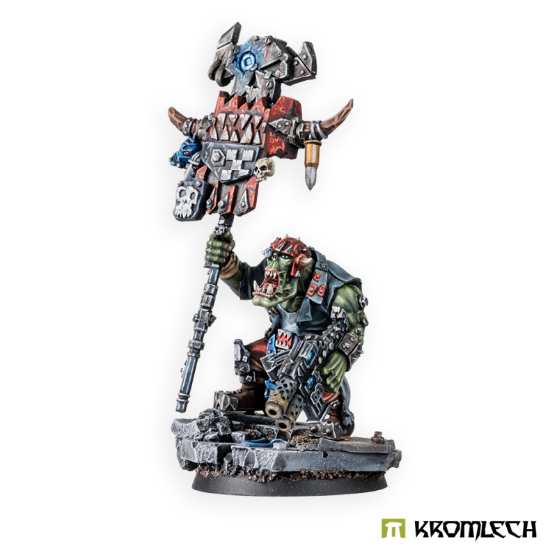 Kromlech Orc Greatcoat Banner Bearer painted: crouching green orc holding a skull-faced banner and a double-barrelled gun