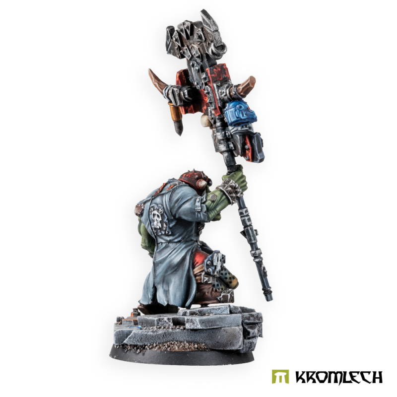 The painted banner bearer from the side, his long greatcoat in view