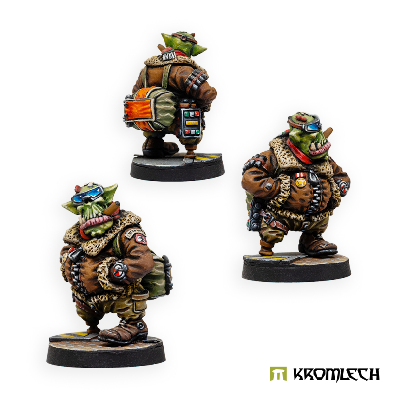 The painted Green Baron from the front, side and back, a drum-shaped pack on his back