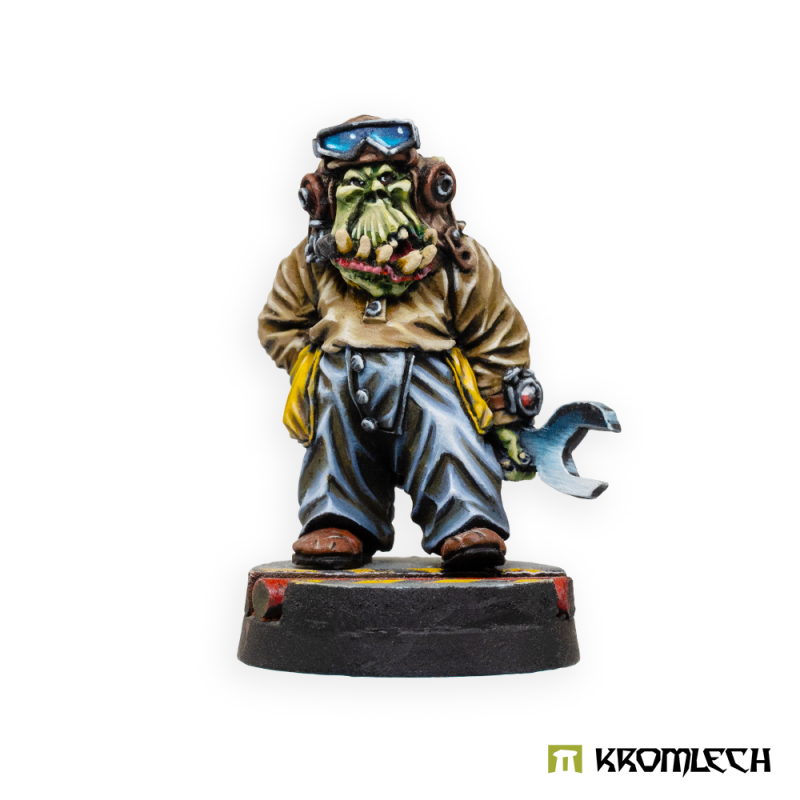 Kromlech Orc Mechanic painted: an orc in a goggled flying cap and baggy work trousers holding a big spanner