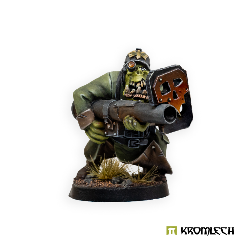 Kromlech Orc Panzerschreck painted: a crouching orc in a green greatcoat aiming a launcher with a skull blast shield