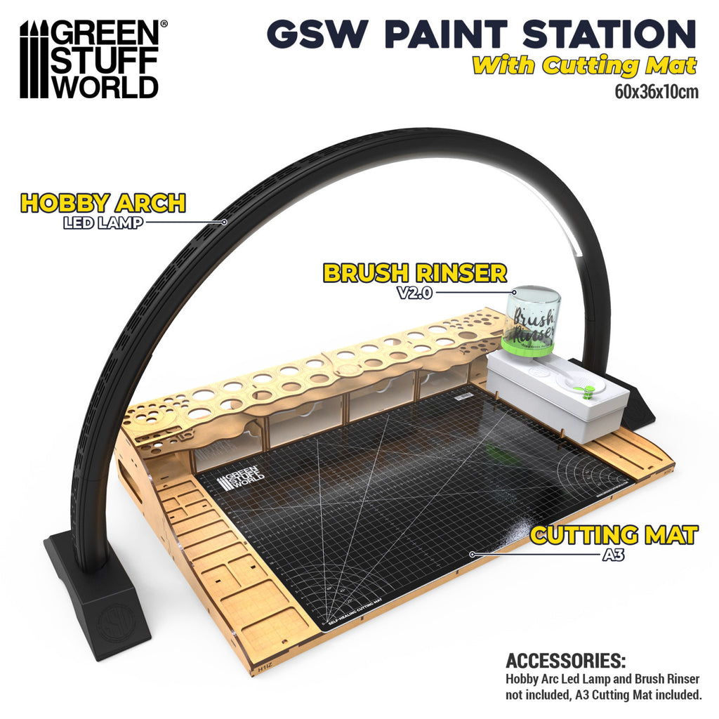 Paint station setup with cutting mat and brush rinser for miniature painting