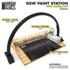 Paint station setup with cutting mat and brush rinser for miniature painting
