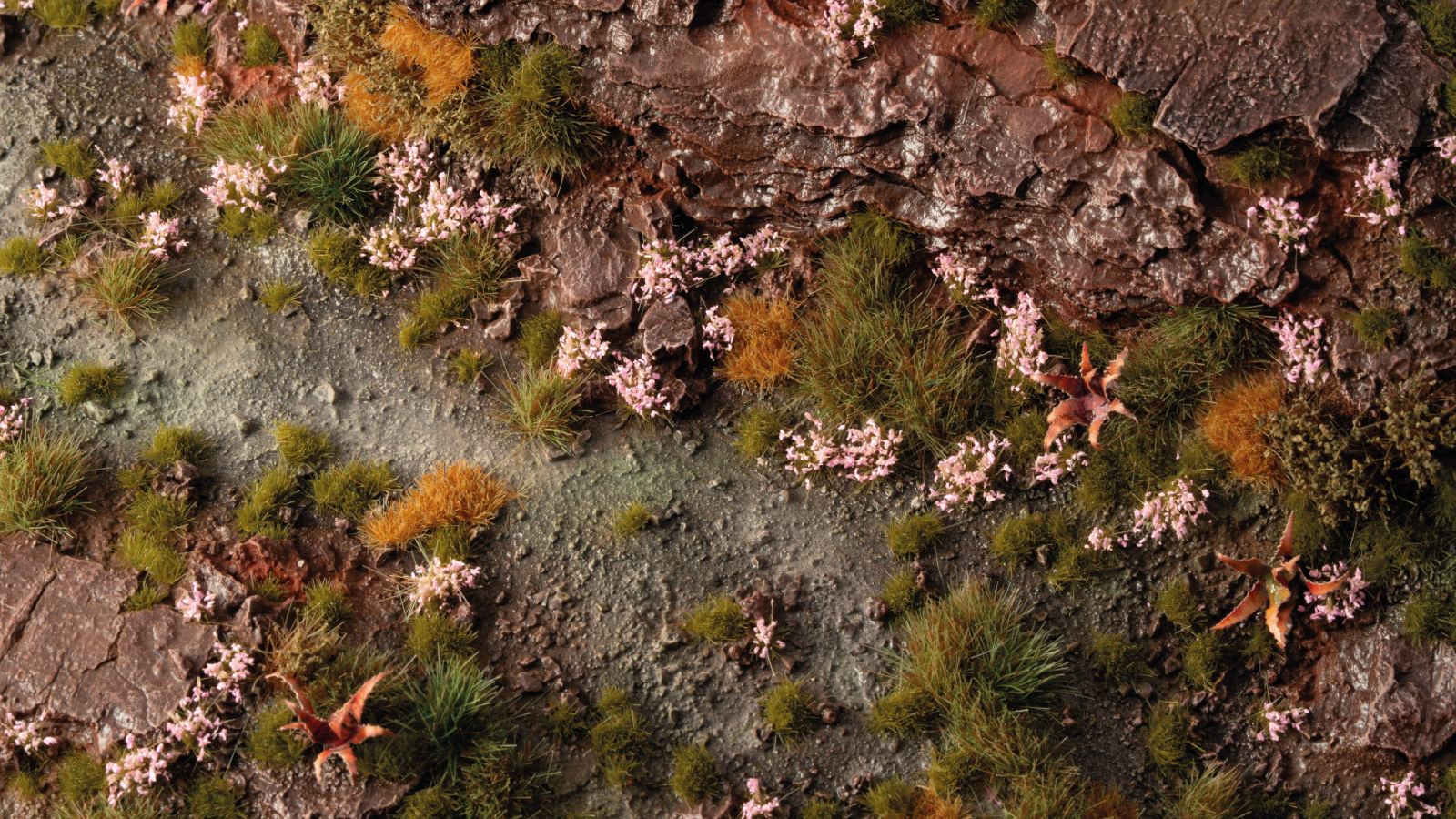 GamersGrass Pink Orchid Tiny Flowers used in a scenic diorama with realistic pink blossoms