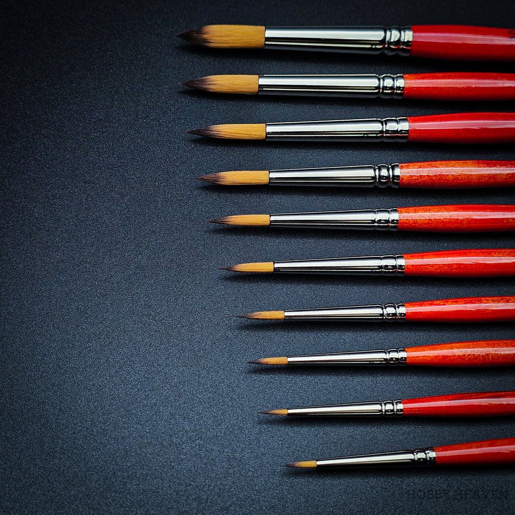 Close-up of Raphael Series 8394 Kaerell round brushes with red handles for fine detail and watercolour painting