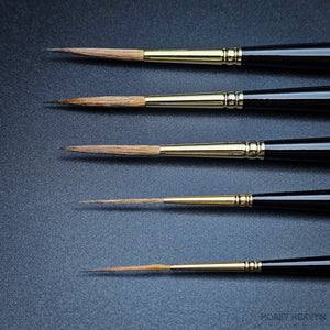 Close-up of Raphael 8802 Kolinsky Sable Rigger brush tips showing ultra-fine precision for model painting and illustration