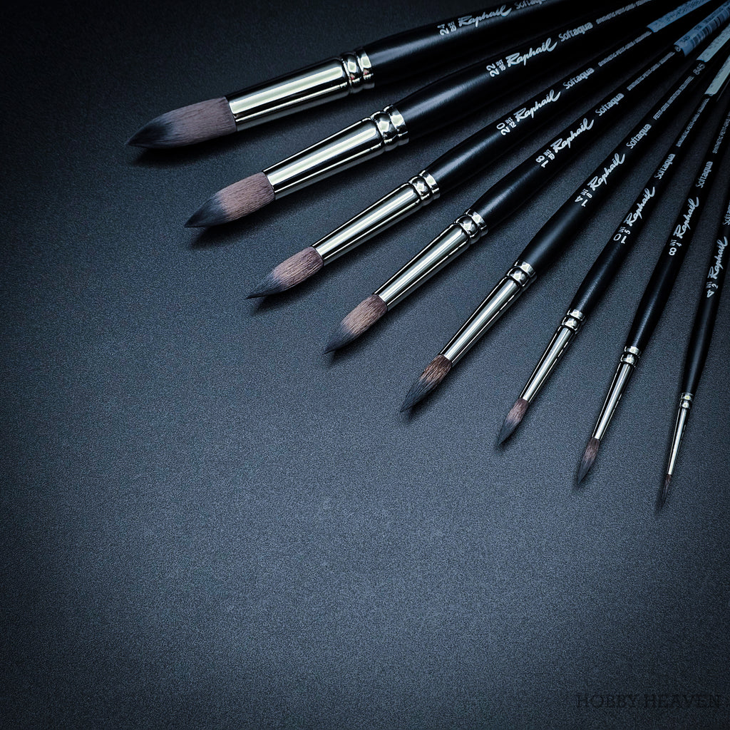 Close-up of Raphaël Softaqua 845 round brushes showing fine pointed synthetic squirrel tips for detailed watercolour work