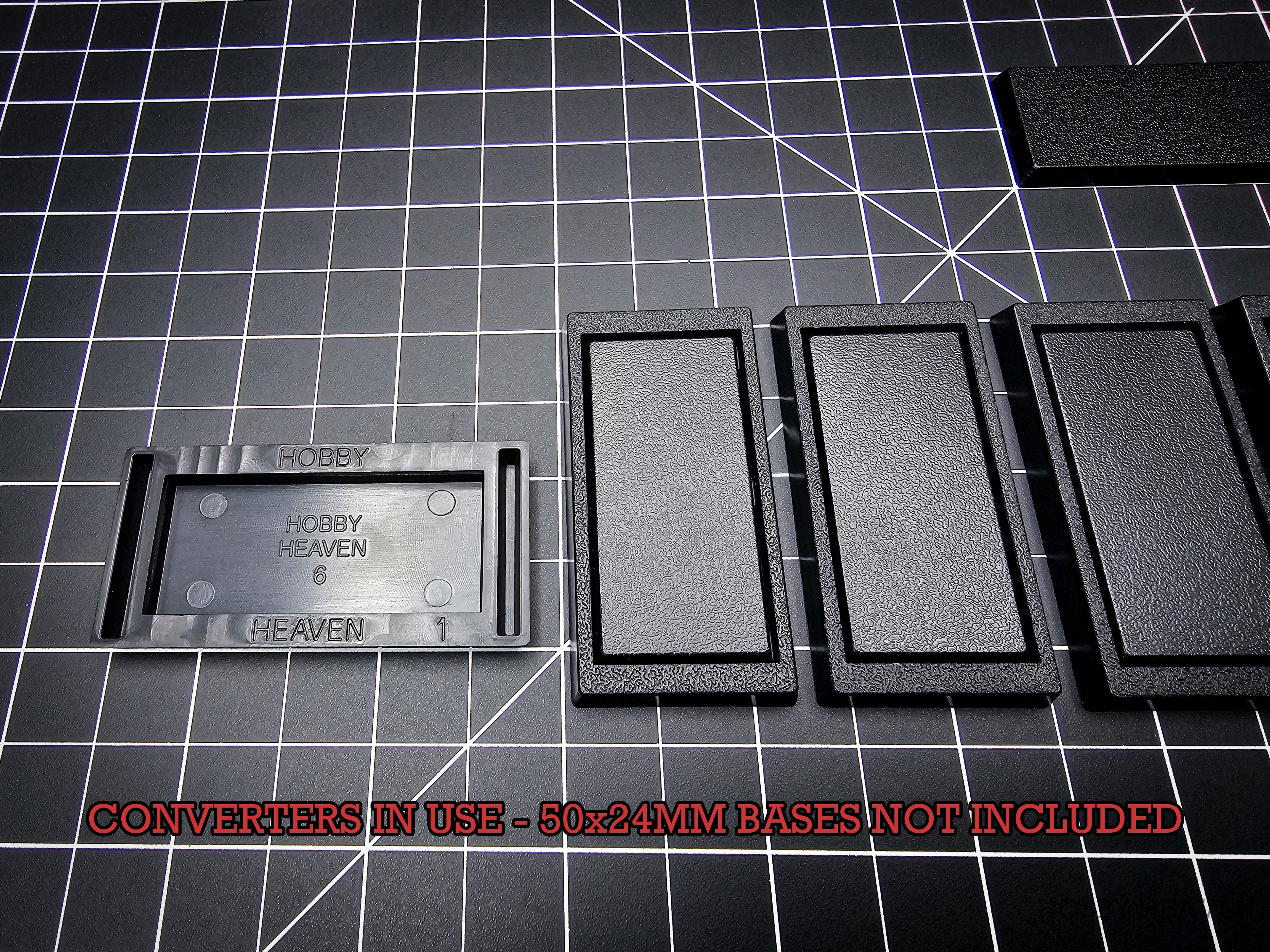 Rectangle base converter 50x24mm to 60x30mm – demonstration on cutting mat – Hobby Heaven