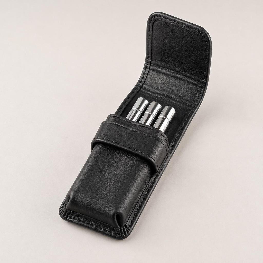 Open Rosemary & Co 3 pocket leather brush wallet showing short travel brushes stored in individual pockets