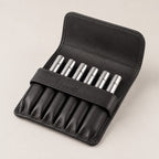 Open Rosemary & Co black leather 6 pocket brush wallet showing short travel brushes stored in individual sleeves