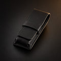 Rosemary & Co black leather 3 pocket brush wallet shown closed for storing pocket travel brushes