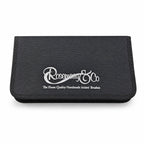 Closed Rosemary & Co black nylon brush case with white logo, slim zip-around design and textured outer cover