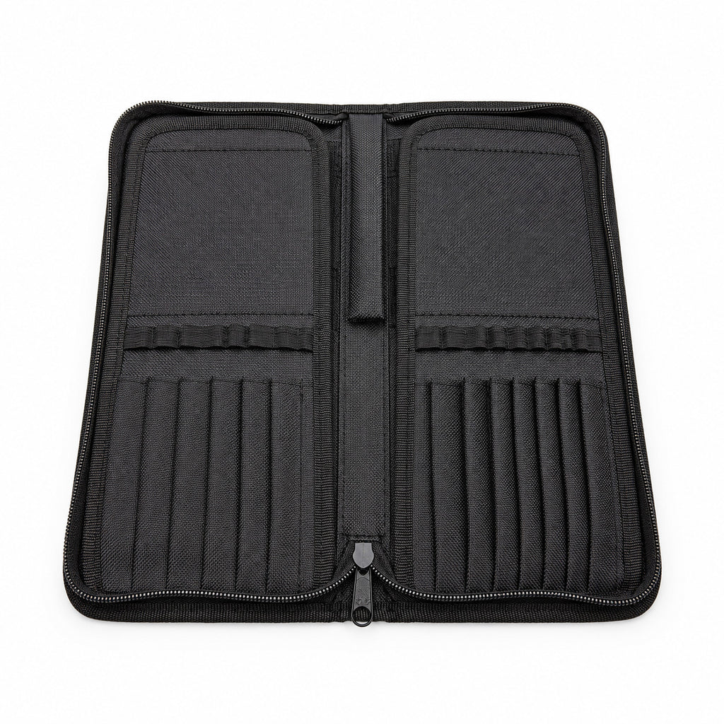 Open Rosemary & Co black nylon brush case showing empty brush dividers, elastic loops and zip-around storage layout