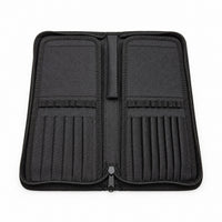 Open Rosemary & Co black nylon brush case showing empty brush dividers, elastic loops and zip-around storage layout
