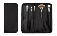 Rosemary & Co black nylon brush case shown open and closed, with individual brush pockets and zip-around storage design
