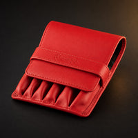 Rosemary & Co red leather 6 pocket brush wallet shown closed for storing short pocket travel brushes
