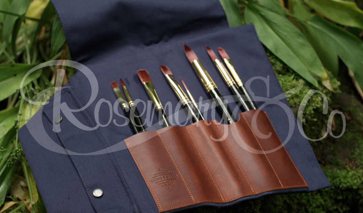 Open Rosemary & Co short handle leather fabric brush wrap showing artist brushes stored in individual canvas and leather pouches