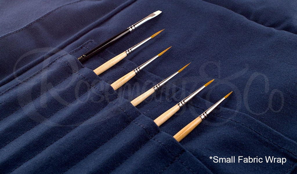 Close-up of Rosemary & Co small navy fabric brush wrap with brushes stored in stitched canvas pouches
