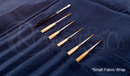 Close-up of Rosemary & Co small navy fabric brush wrap with brushes stored in stitched canvas pouches