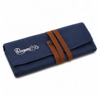Closed Rosemary & Co small navy canvas brush wrap with wrap-around leather strap and press-stud closure
