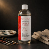 Rosemary & Co brush cleaner 250ml on a dark studio bench with sable brushes, ceramic palette and paint-stained cloth
