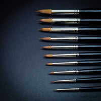Close-up of fine pointed tips of Rosemary & Co Red Dot Spotters brushes
