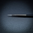 Close-up of Snowdrop size 0 brush head showing the fine white taklon point
