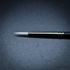 Close-up of Snowdrop size 2 brush head showing the tapered white taklon point