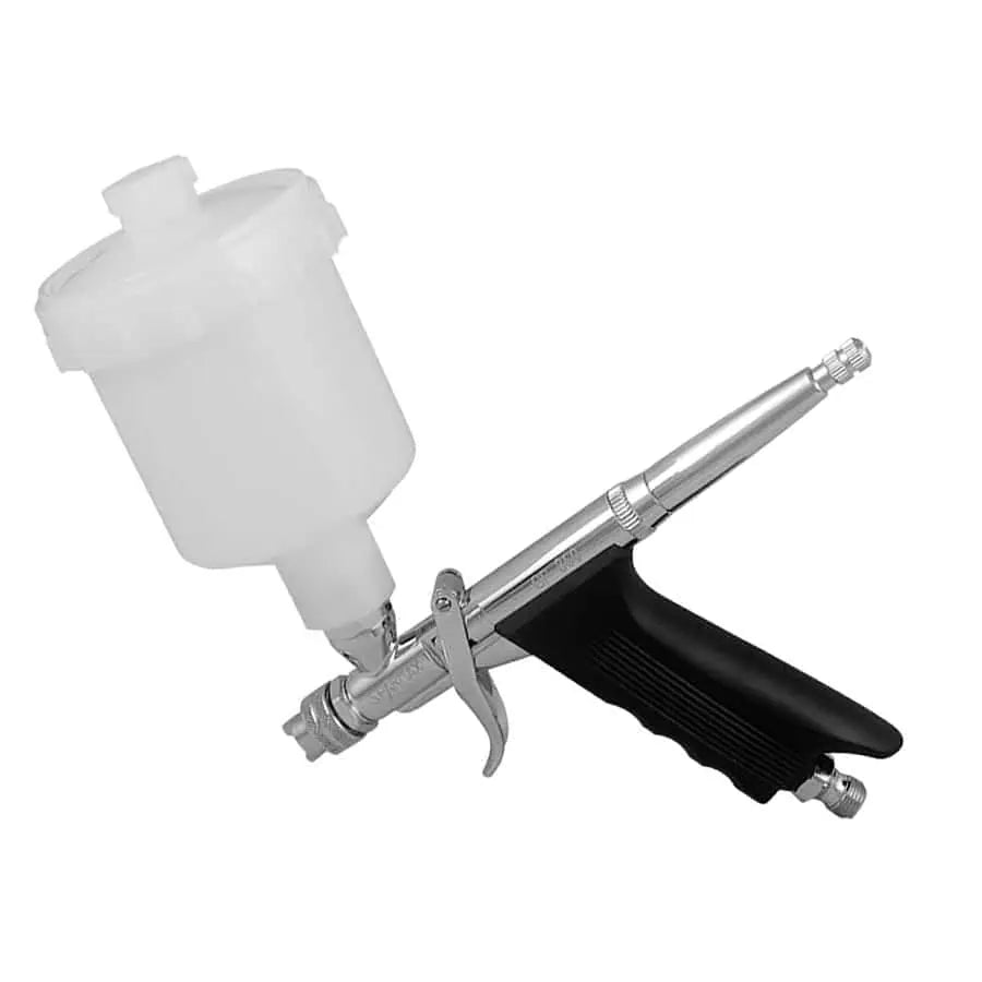 Sparmax GP-850 on white at an angle, white gravity cup fitted, showing the pistol grip and air inlet