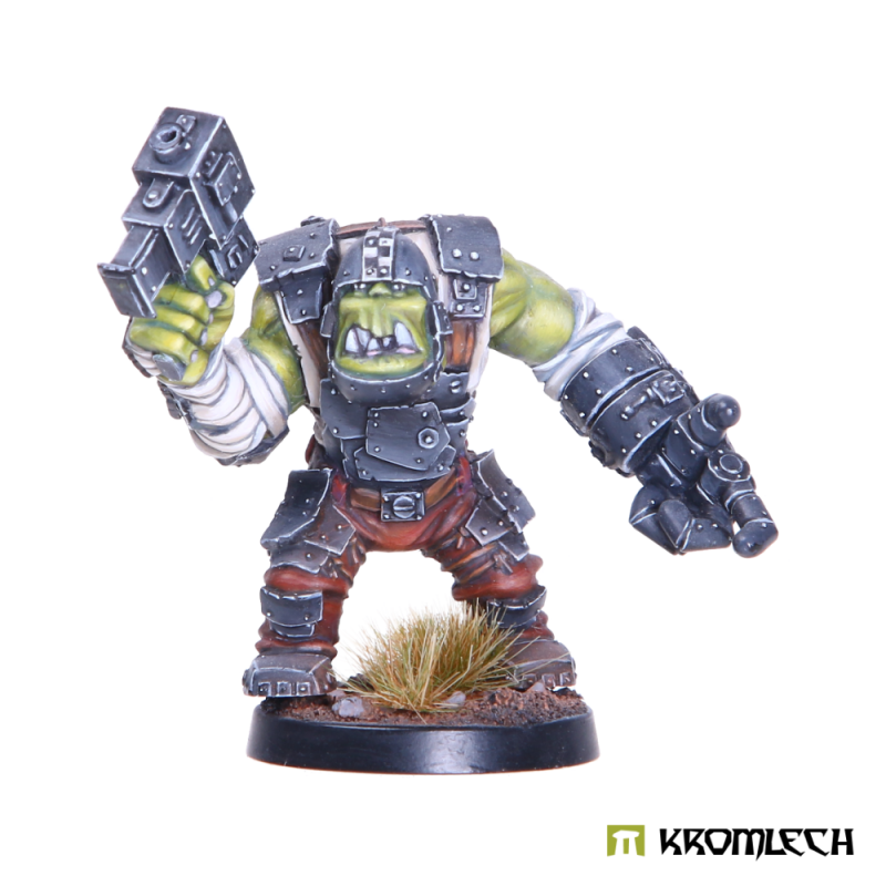 Kromlech Snagrat Kromm painted: an armoured orc raising a boxy pistol, his other arm in a heavy plated gauntlet