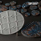Close-up of 120mm oval Spaceship Corridor base showing comprehensive magnet mounting system and reinforced structure
