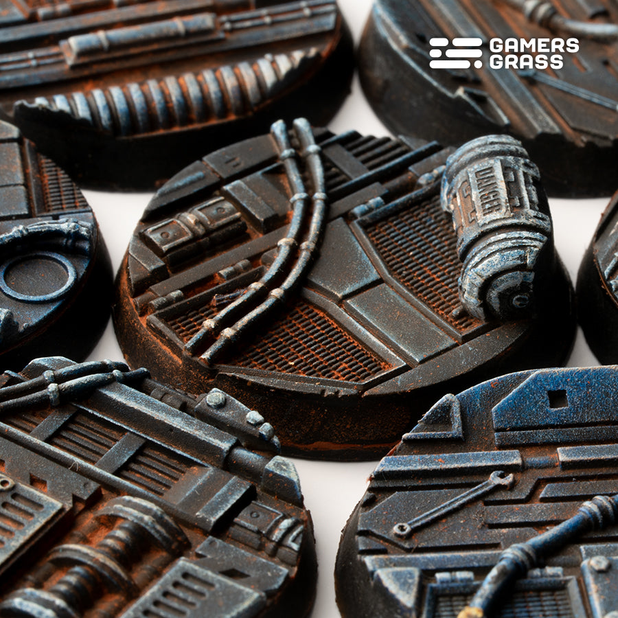 Macro view of 32mm Spaceship Corridor bases with cabling looping over mesh flooring and a rust-streaked DANGER canister