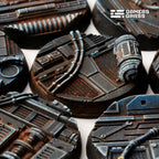 Macro view of 32mm Spaceship Corridor bases with cabling looping over mesh flooring and a rust-streaked DANGER canister