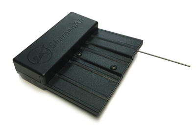 SharpenAir needle repair tool on white with an airbrush needle inserted into one of its angled runners