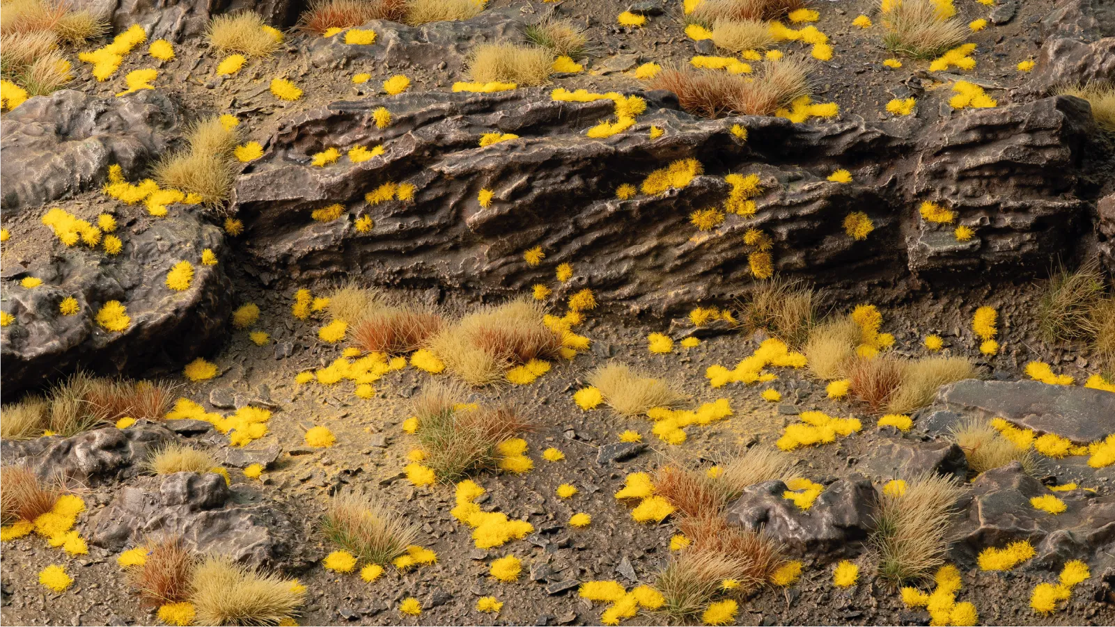 Gamers Grass Tiny Golden 1mm tufts applied to rocky terrain diorama showing lichen effect on stone surfaces