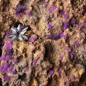 Enigmatic diorama featuring Tiny Tufts Alien Purple, showcasing a mystical alien landscape or magical realm with purple micro-flora