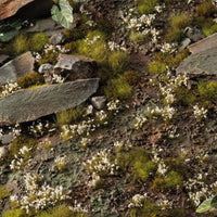 White Lily Tiny Flowers tufts used in a scenic diorama with rocks and greenery for scale models