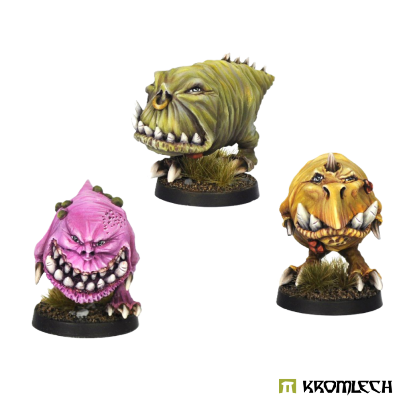 Three painted Gnaws in pink, olive and yellow, big toothy mouths to the front