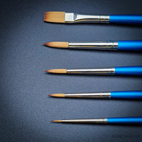 Winsor & Newton Cotman 5-piece brush set for watercolour, featuring a range of round and one-stroke brushes with ergonomic handles.
