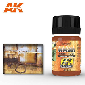 Applying AK046 Light Rust Wash on vehicle models to create realistic rust and weathering effects.