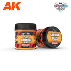 Two jars of AK1221 Sunrise Blaze terrain paste, one upright, one on its side; label reads AK Wargame Terrain, lid 100ml