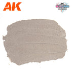 A spread swatch of AK1229 Concrete on white, showing the finely pitted cement-like surface it dries to