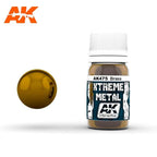 AK475 Xtreme Metal Brass: 30ml bottle with a ribbed white cap, beside a glossy warm gold-brown brass sphere.