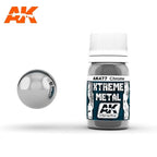 AK477 Xtreme Metal Chrome: 30ml Xtreme Metal bottle with a white ribbed cap, beside a mirror-bright chrome sphere.
