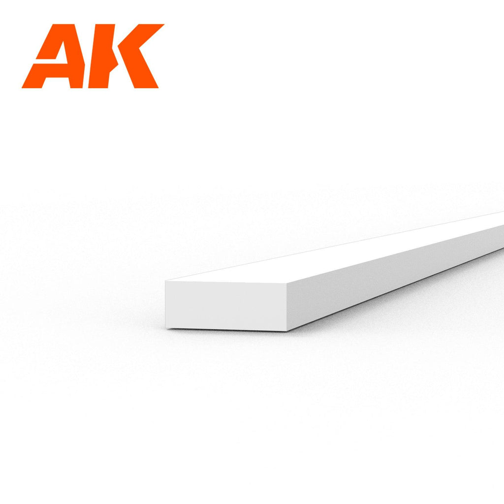 AK6515 styrene strip on white: a flat white plastic length, its end face some two and a half times wider than it is thick
