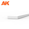 AK6516 styrene strip on white: a broad flat white plastic length, its end face four times wider than it is thick