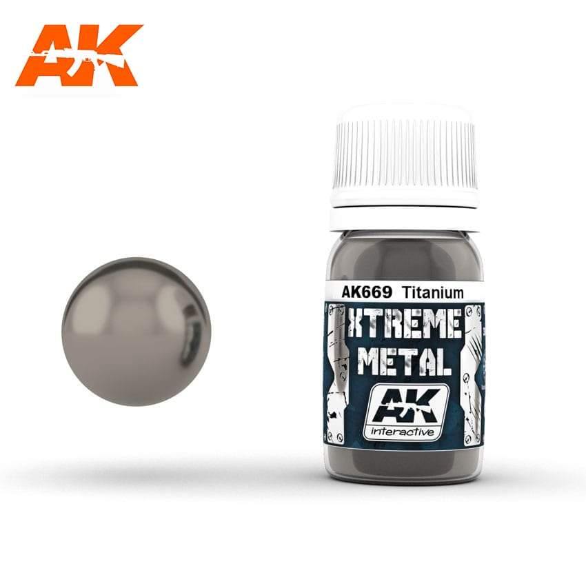 AK669 Xtreme Metal Titanium: 30ml bottle with a ribbed white cap, beside a mirror-bright neutral grey-taupe sphere.