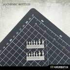 Two resin sprues of Kromlech Alchemic Bottles on cutting mat with Kromlech-branded casting frames