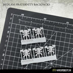 Kromlech Bedlam Fraternity Backpacks five resin pieces on sprues with cutting mat for scale