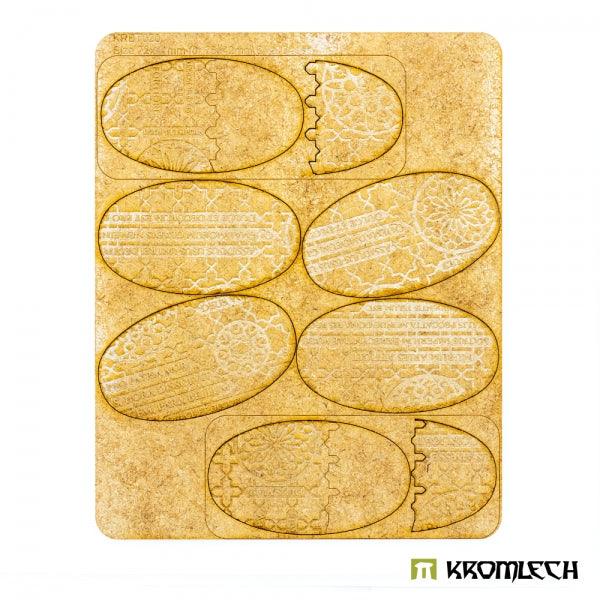 Kromlech KRBT020 HDF sprue sheet with six 75x42mm oval Cathedral base toppers before removal